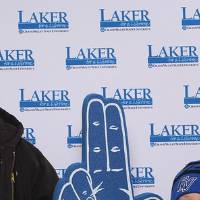 Father and son smiling together